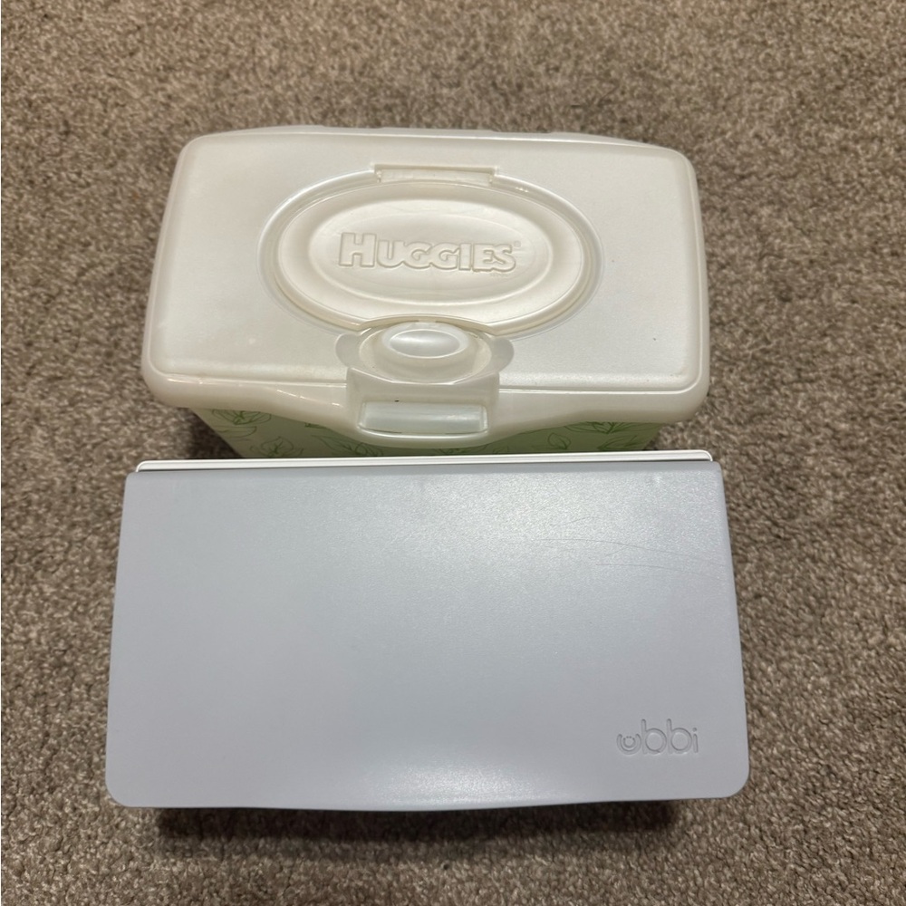Ubbi and Huggies wipe holder. Ubbi brand is weighted